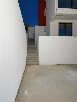Exterior of the house with external stairs and yard. - image 5