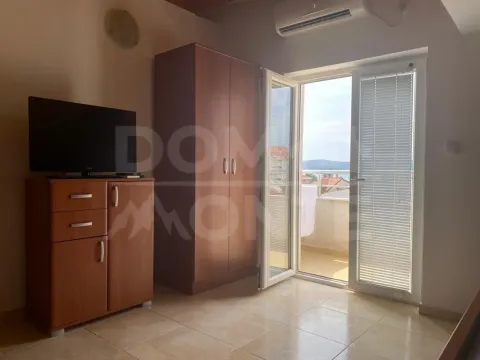 Living room with a wardrobe, TV cabinet, and access to the terrace. - image 3