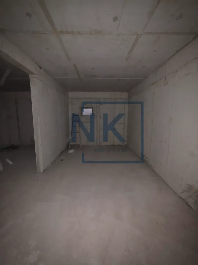 Unfinished room in grey phase of construction.