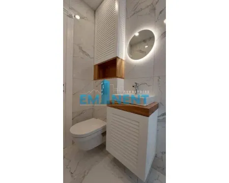 Modernly equipped bathroom with sanitaryware and built-in elements. - image 10