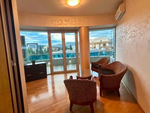Living room with seating furniture and access to the terrace. - image 8