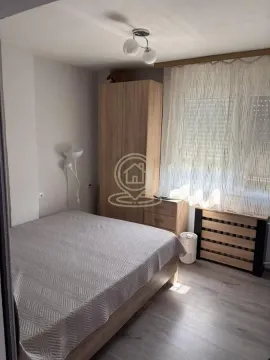 Furnished bedroom with a double bed, wardrobe, and a window. - image 5