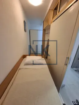 Small bedroom with a bed and a wardrobe. - image 6
