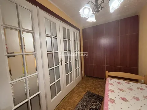 Furnished bedroom with built-in wardrobes and a bed. - image 5