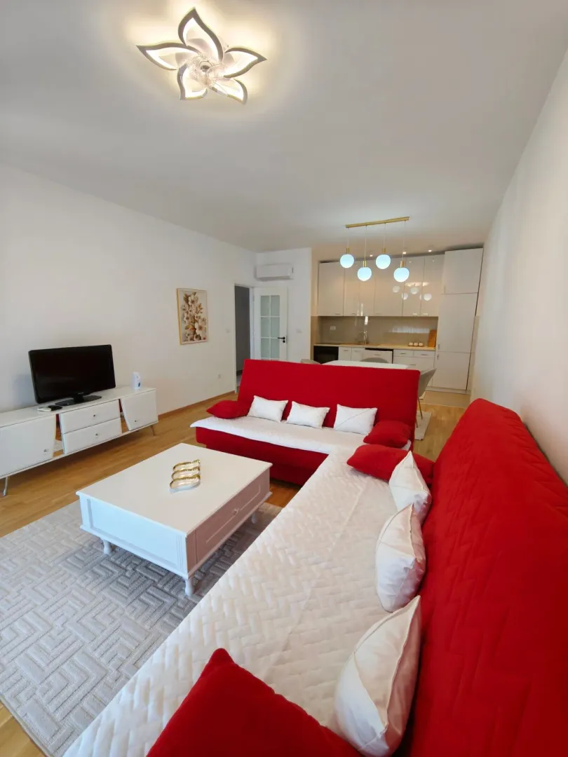Spacious living room connected to the dining area and kitchen.