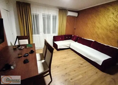 Living room with a sofa set and a dining table. - image 2