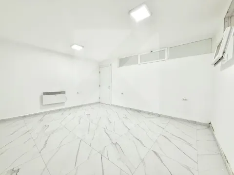 Empty room with white walls and marble tile flooring. - image 4