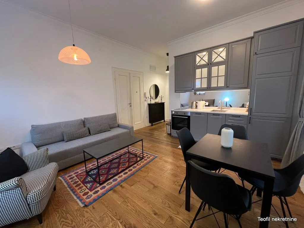 Living room with open-plan kitchen and dining area.