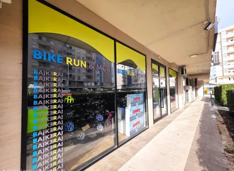 Exterior view of a commercial space with a large storefront. - image 8