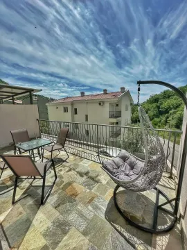 Furnished terrace with seating furniture and a swing chair. - image 20