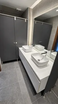 Modernly equipped bathroom with two washbasins and a large mirror. - image 12