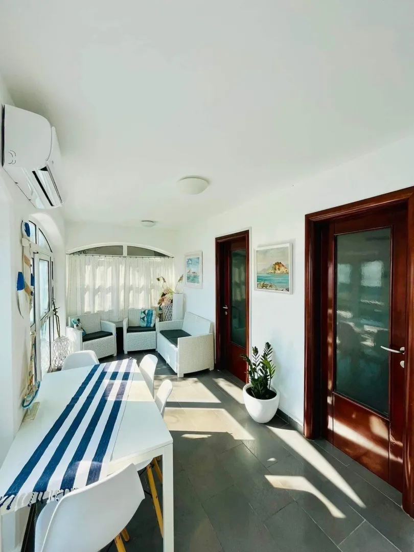 Living room with a dining table and seating set.