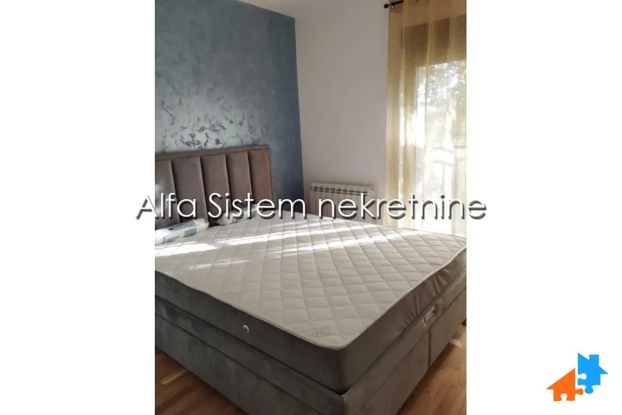 Furnished bedroom with a double bed.