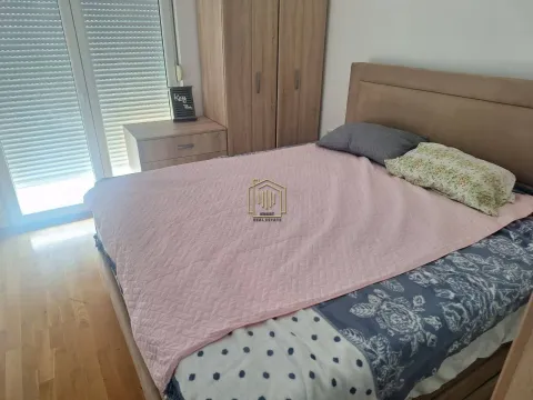 Bedroom with a double bed, wardrobe, and access to the terrace. - image 4
