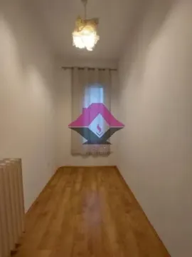 Empty room with a window and wooden floor. - image 19