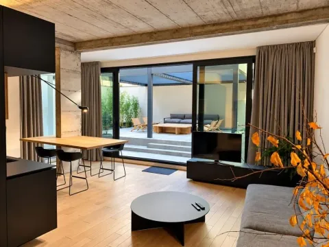 Modern living room with dining area and access to the terrace. - image 6