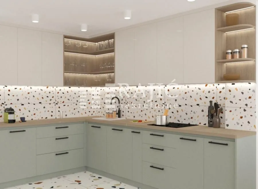 Modern kitchen with light cabinets and terrazzo tiles.