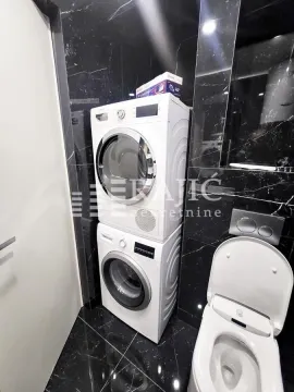 Modernly equipped bathroom with built-in washing and drying machine. - image 7