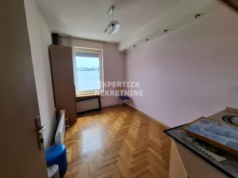 Empty room with parquet flooring and a window. - image 4