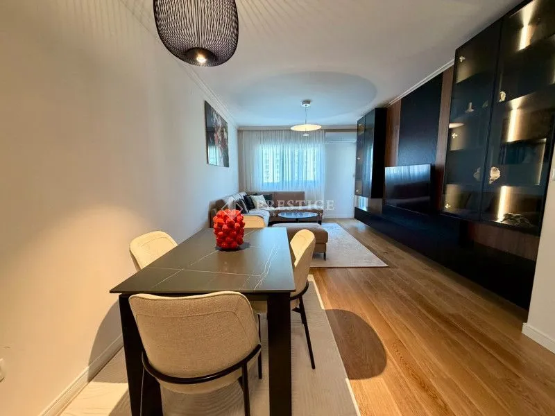 Living room with dining area and modern furniture.