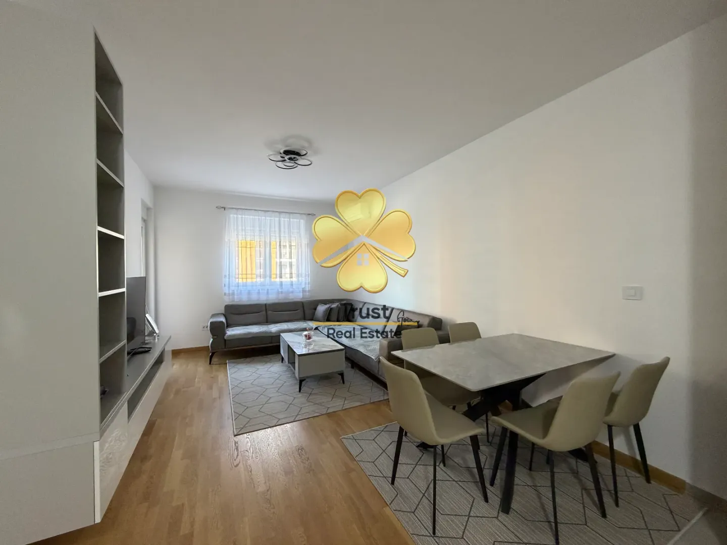 Living room with a sofa and a dining table.