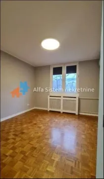 Empty room with parquet flooring and a window. - image 7