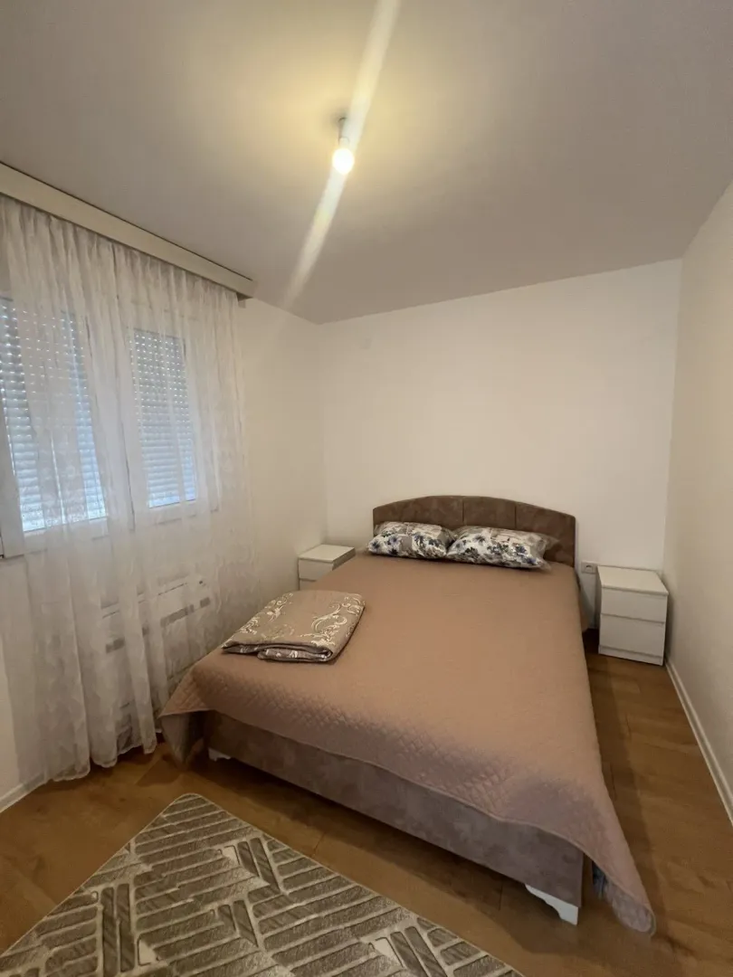 Bright bedroom with a double bed.