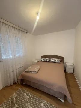 Bright bedroom with a double bed. - image 5