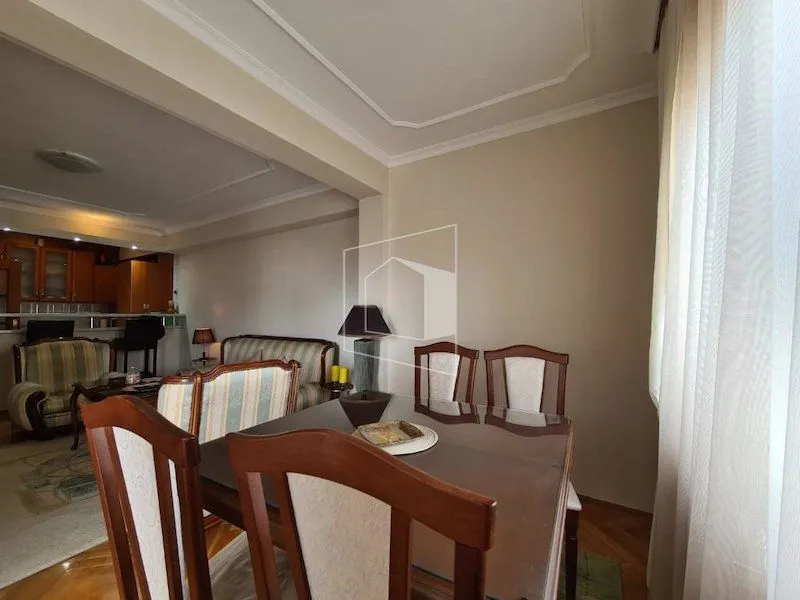 Living room with dining area and seating set.