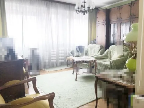 Furnished living room with a sofa set and vintage wooden furniture. - image 2