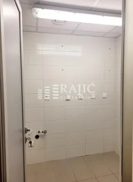 Empty bathroom tiled with white ceramic tiles. - image 5