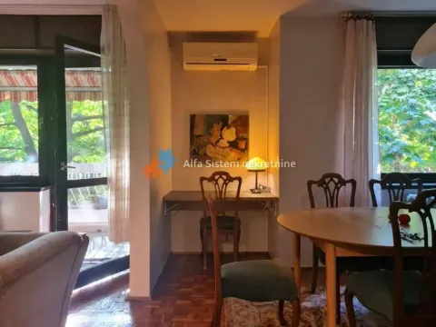 Living room with a dining area, desk, and access to the terrace. - image 8