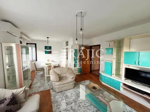 Spacious living room with seating area and dining space in the background. - image 2