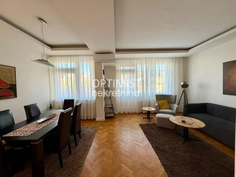 Spacious living room with a dining area and seating set.