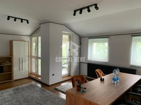 Spacious bright room with a desk and shelving units. - image 9