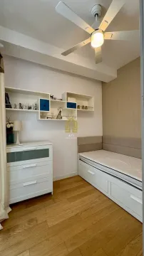 Small bedroom with a bed, dresser, and wall shelves. - image 6