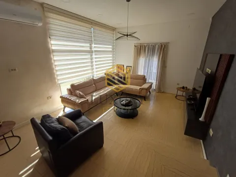Spacious living room with sofa set and large windows. - image 20