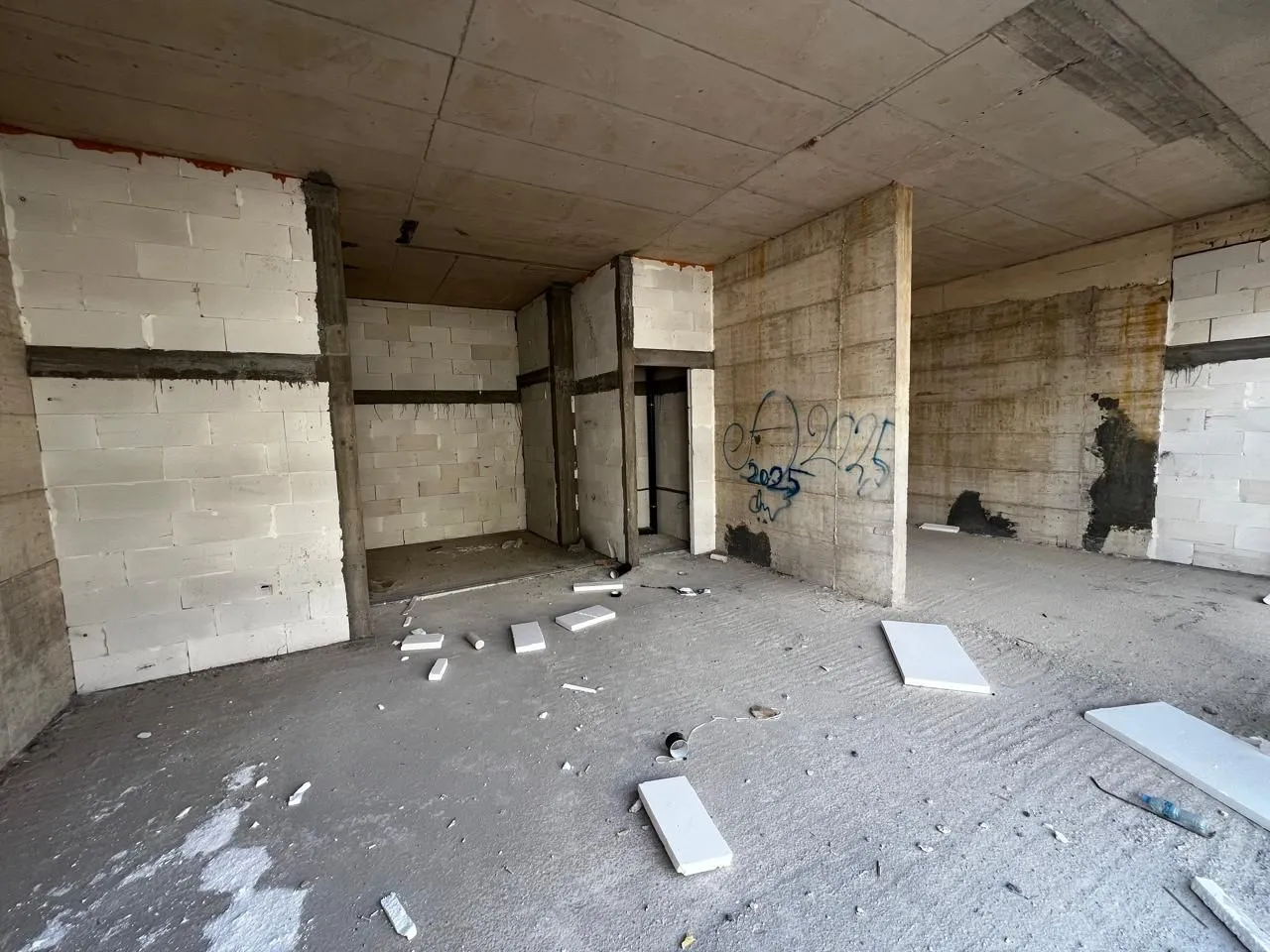 View of an unfinished interior under construction.