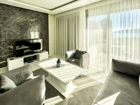 Modern and bright living room with seating area and sea view. - image 3