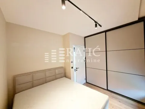 Furnished bedroom with a large wardrobe and a double bed. - image 9