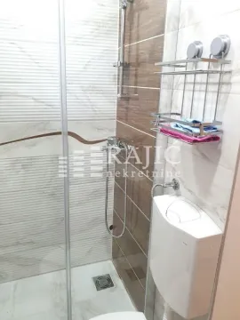View of the bathroom with a shower cabin and sanitary ware. - image 15
