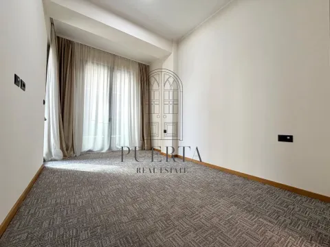 Empty room with carpeted flooring and balcony doors with curtains. - image 9