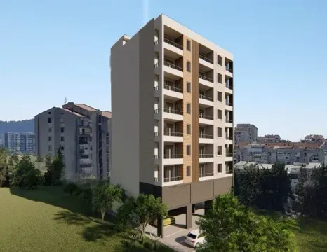 Exterior view of a new residential building with balconies and ground-floor parking. - image 2