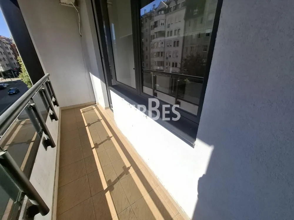 View of the balcony and surrounding buildings.