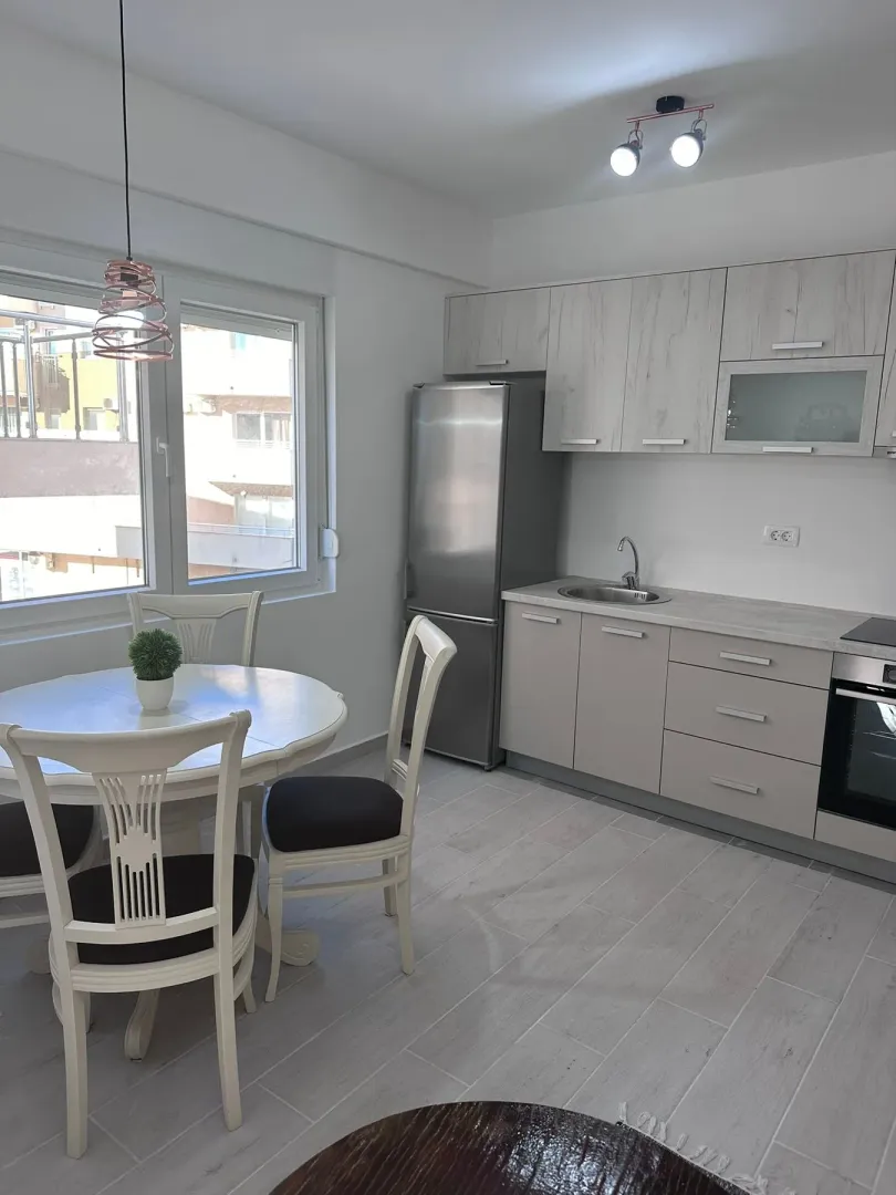 Bright kitchen with a dining area and modern elements.