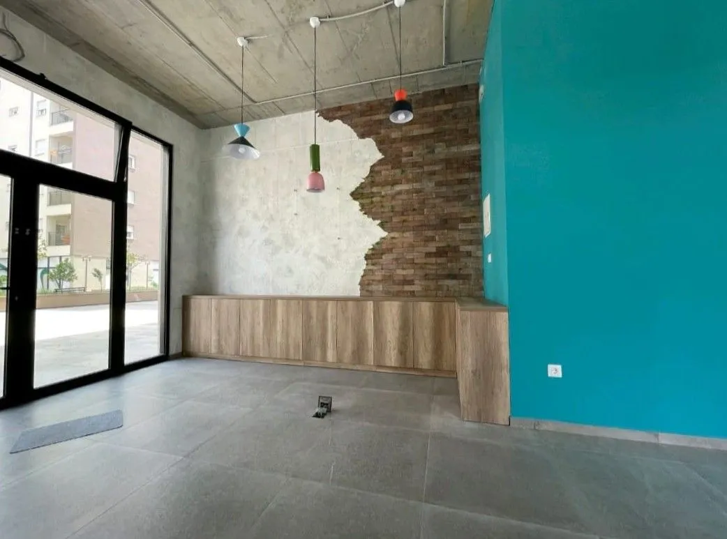 Empty room with a decorative brick accent wall and a blue wall.