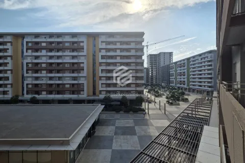 View from the terrace overlooking surrounding residential buildings and a paved plateau. - image 14