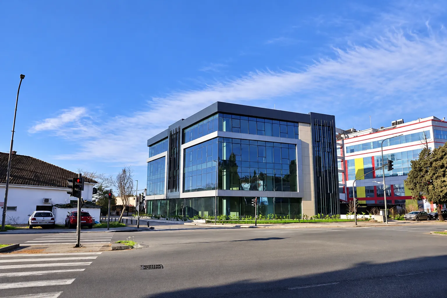 View of a modern commercial building with a glass facade.