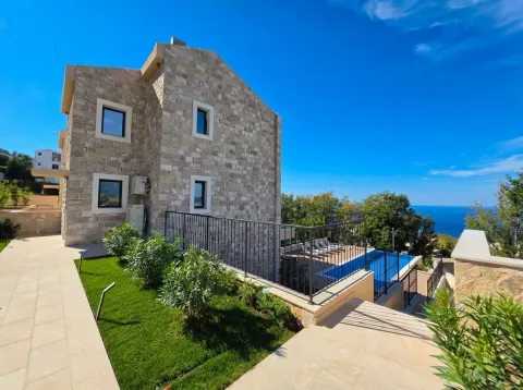 Exterior of a stone house with a swimming pool and sea view. - image 10