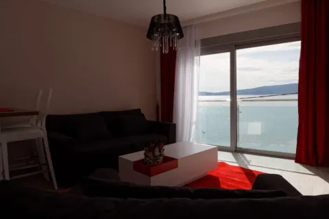 Living room with sofa, coffee table and sea view. - image 10
